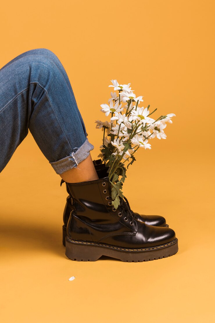 sitting-female-legs-boots-with-flowers-inside_23-2148098451
